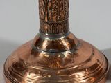 a close up of a pair of candles on top of a table