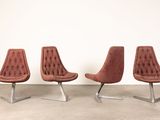 set of four mid - century style chairs with tufted upholstered upholstered seats
