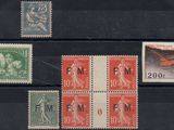 four different stamps on a black box with a picture of a man and a woman