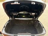 an open trunk of a car with the trunk lid open