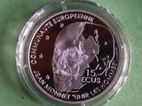 a close up of a coin with a skull on it
