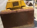 a bulldozer that is sitting in the dirt