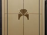 a tall cabinet with a door that has a bow on it