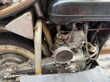 a close up view of a motorcycle engine with a radiator