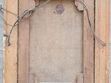 a close up of a picture frame hanging on a wall