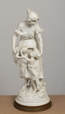 statue of a woman holding a child in her arms