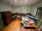 an image of a home office with a desk and bookshelf