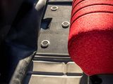 a red seat in the back of a red car