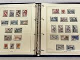 an open book with stamps on it sitting on a table