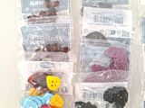 a lot of buttons in the bags on the table