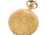 une image représentant un cadenas doré orné d'un motif floral