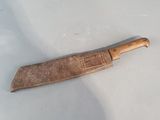 a knife that is laying on a white surface