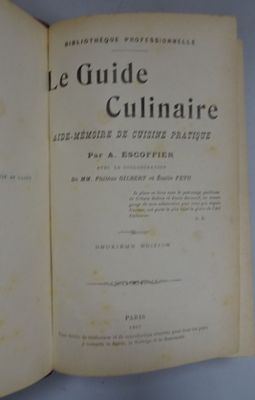 an open book on a blue table with a white background