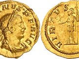 a gold coin with an image of a woman holding a sword