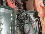 a green box with tools in it sitting on a counter