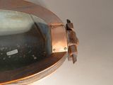a close up of a metal bowl on a table