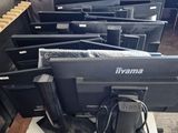 a lot of tvs that are sitting on a table