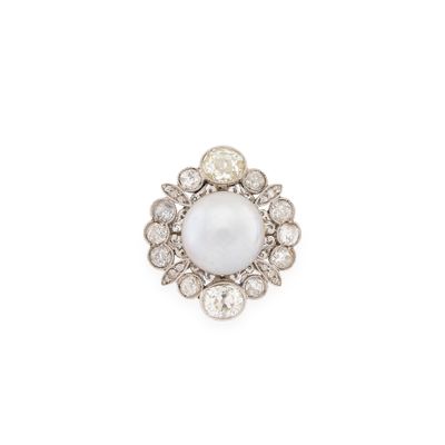 a white pearl and diamond ring