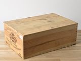 a wooden box that is sitting on a wooden floor