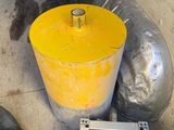 a yellow bucket sitting next to a yellow fire hydrant