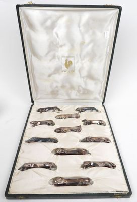a case that has a bunch of silver spoons in it