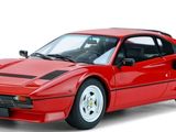 the red sports car is parked on a white surface