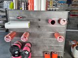 a picture of a metal rack with several rolls of paper