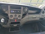 a dashboard of a car with a radio and a steering wheel