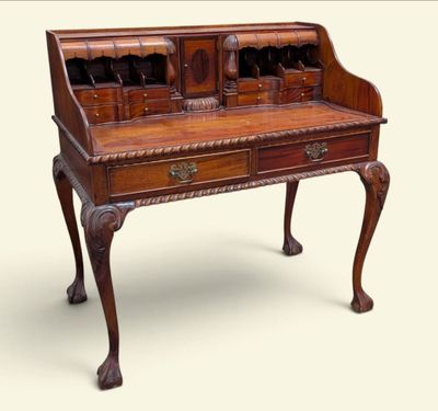 an old wooden desk with two drawers and a drawer underneath it