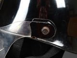a close up of a helmet with a metal buckle