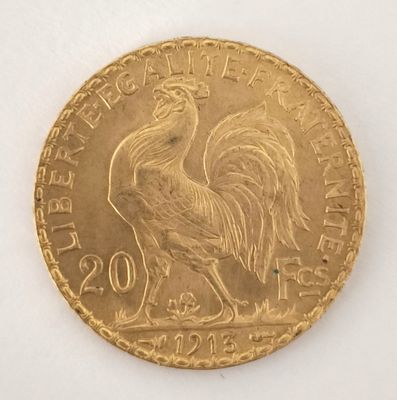 l'image d'une pièce d'or ornée d'un coq