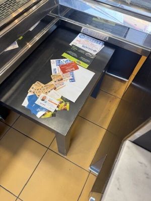 a table that has a laptop on it in a kitchen