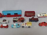 a lot of toy cars and trucks that are on a table