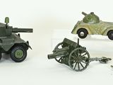 four toy vehicles that are sitting next to each other