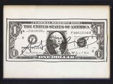 une vieille photo d'un billet d'un dollar sur lequel figure le portrait du président George Washington