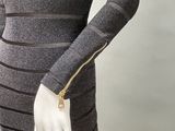 a mannequin dress with a zippered neckline and long sleeves