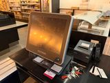 a laptop computer sitting on top of a desk in a store