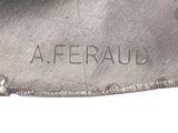 a close up of a silver plate with a name on it