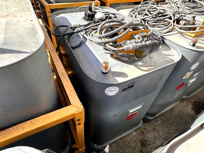 many different types of tanks and hoses on the side of the road