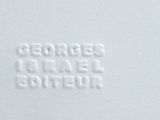 a close up of a white plate with a name on it