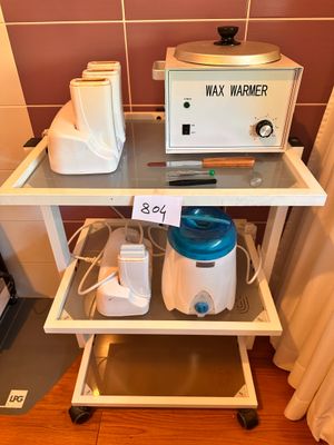 a picture of a microwave and a blender on a cart