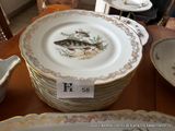 a lot of plates that are sitting on a table