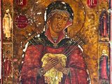 une peinture ancienne représentant une femme tenant un bébé dans ses bras