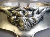 a silver spoon with a picture of a man and a woman on it