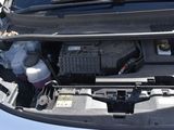 a car that has its hood open with the engine in it