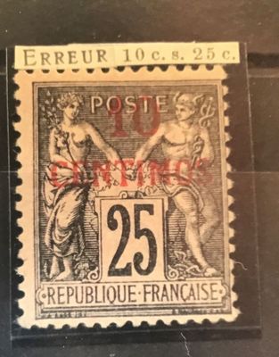 un vieux timbre-poste sur lequel figurent une femme et un homme