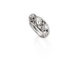 a close up of a diamond ring on a white background