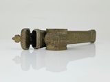 an old brass object on a white surface with a white background