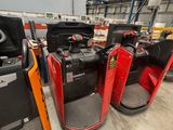 many different types of forklifts in a warehouse