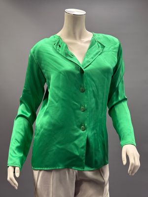 an image of a mannequin wearing a green shirt and beige pants
